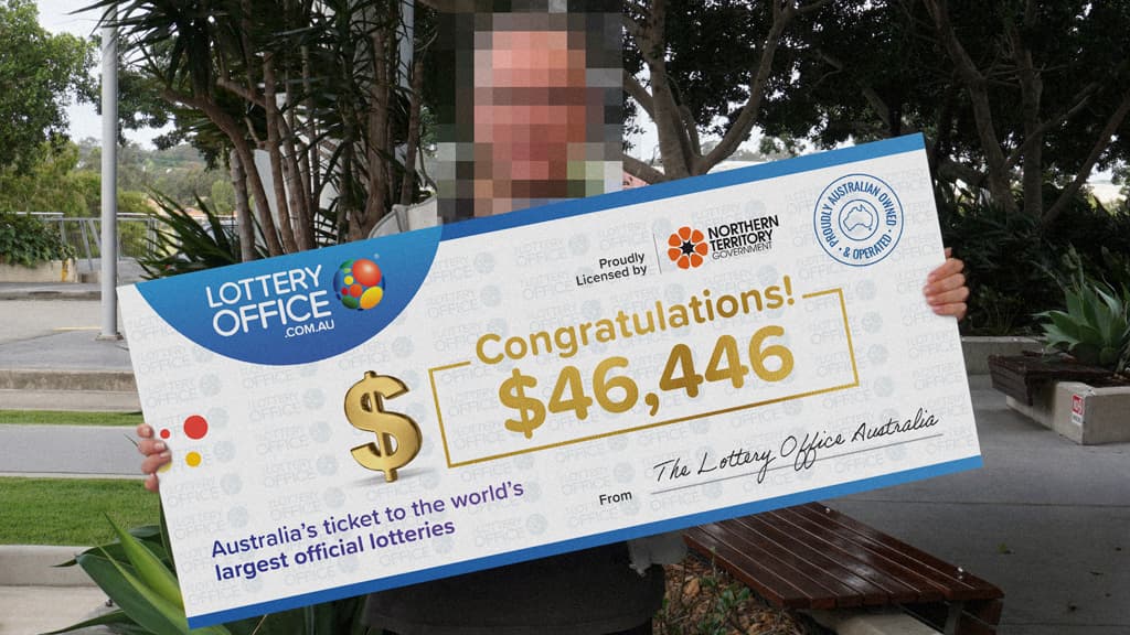 Winner holding a cheque.