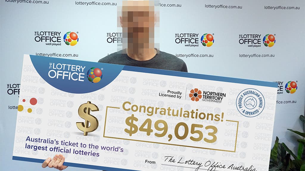 Man holding cheque.