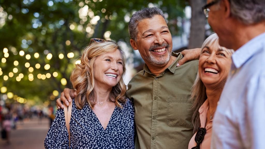 Group of happy senior friends sharing a moment outdoors