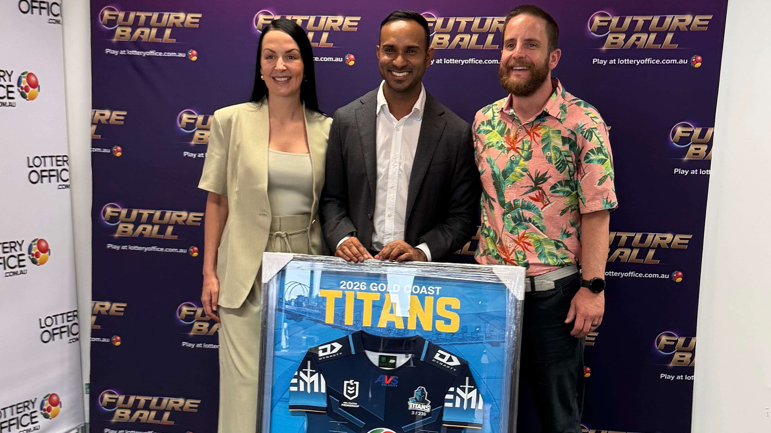 Local MP Leon Rebello receiving a signed Titans jersey