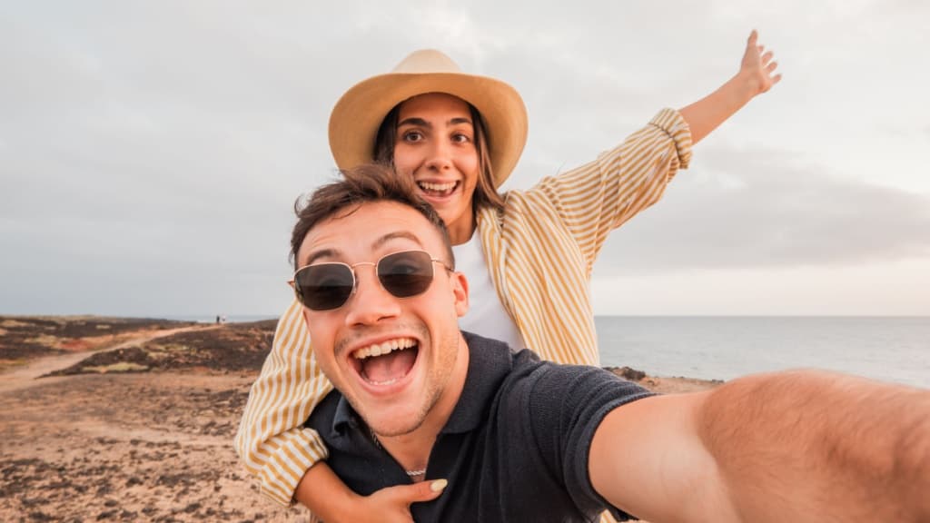 Young couple celebrating.